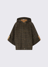 Load image into Gallery viewer, A hooded poncho-style jacket in a dark brown and black plaid pattern, featuring tan elbow patches on the sleeves, shown against a light gray background.