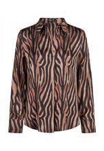 Load image into Gallery viewer, A long-sleeve button-up shirt with a brown and black tiger stripe pattern, featuring a pointed collar and a tie detail at the neck, shown against a plain white background.
