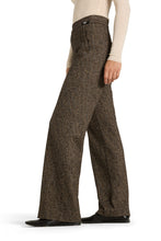 Load image into Gallery viewer, Brown herringbone pants worn by a person on a white background

